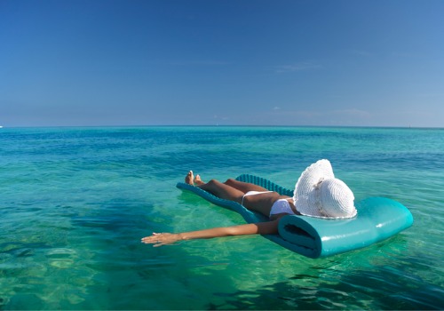 A woman enjoying her vacation to the beach with a Vacation Rental in Tampa FL