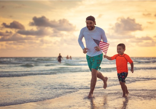 A happy father and son, enjoying their time on the beach with Long-Term Rentals in Tampa FL